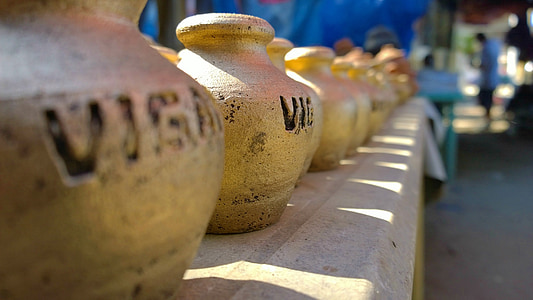 selective focused photo of a brown pot thumbnail