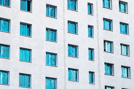 teal and gray concrete high-rise building thumbnail