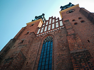 low angle architectural photography of brown brick building thumbnail