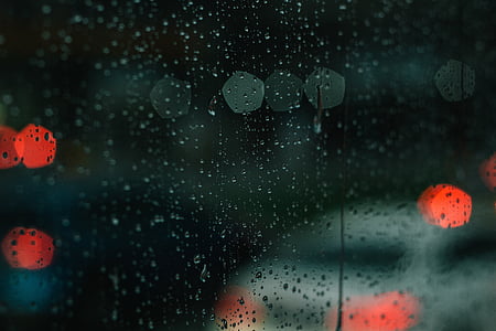 bokeh photography of water droplets on glass thumbnail