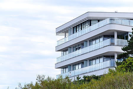 glass white structure building near tree thumbnail