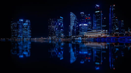 Illuminated Cityscape Against Blue Sky at Night thumbnail