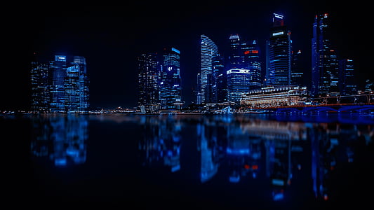 reflective photo of city of at night thumbnail