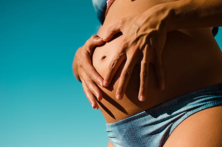 person holding tummy thumbnail