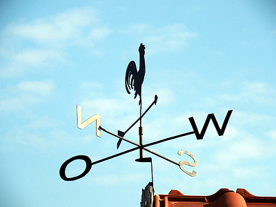 black metal wind vane during daytime thumbnail