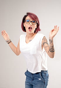 woman wearing white sleeveless pocket shirt and blue denim jeans thumbnail