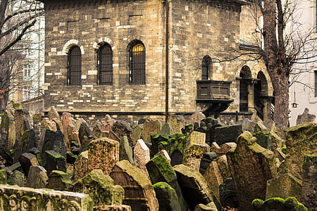 closeup photo of brown concrete tombs near the castle thumbnail