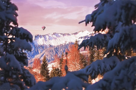 hot air balloon over snow capped mountain thumbnail