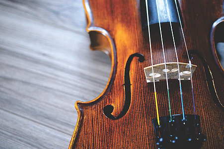 brown violin on gray wooden board thumbnail