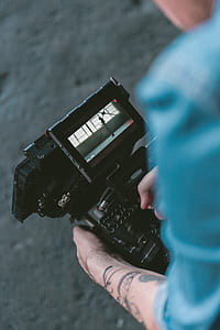 person holding playing camera thumbnail