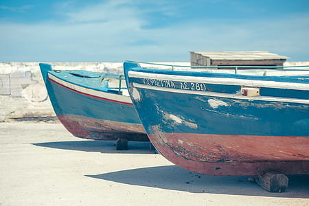 two blue boats on ground thumbnail