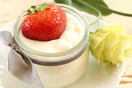 strawberry on top of cream in jar thumbnail