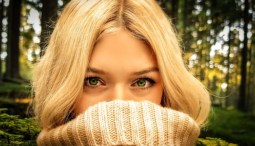 woman half-face covered turtleneck sweater on forest thumbnail