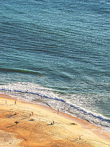 people standing near body of water at daytime thumbnail