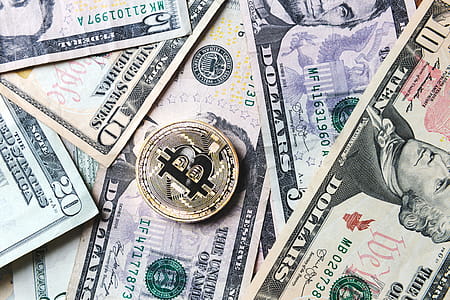 Bitcoin Coin On Bills Of Cash Money Photo thumbnail