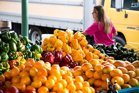 woman standing choosing vegetables thumbnail