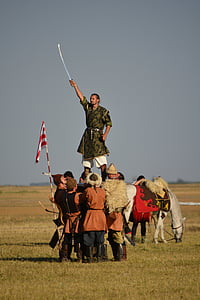 men carrying a man holding sword thumbnail