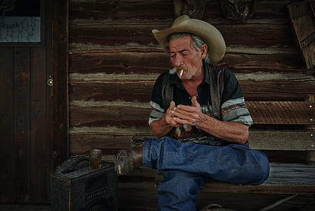 man in black shirt smoking a cigarette thumbnail
