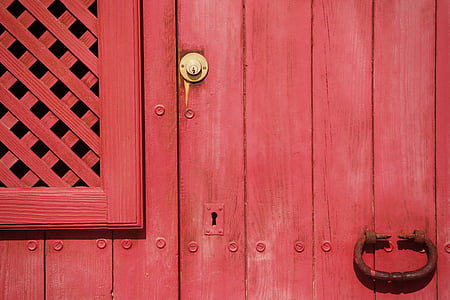 brown steel door knocker on red wooden door thumbnail