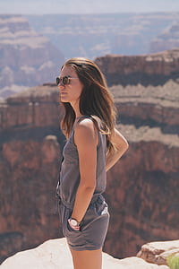 woman standing beside cliff of Grand Canyon Utah thumbnail