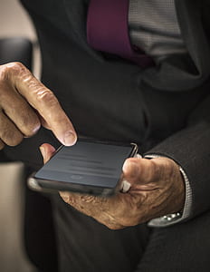 person holding Android smartphone thumbnail