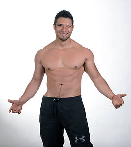 topless man wearing black Under Armour bottoms thumbnail