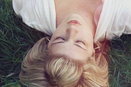 blonde hair woman in green grass thumbnail