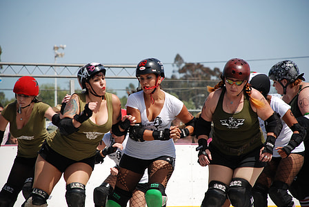 group of women playing skaters outdoors thumbnail