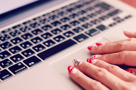 person using MacBook pro thumbnail