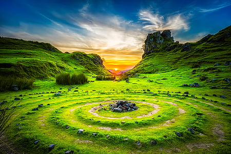 photo of green grass and mountain during daytime thumbnail