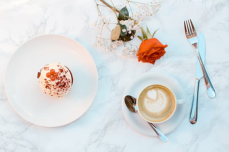 flat lay photography of cappuccino and round cake thumbnail