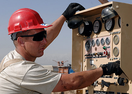man wearing white shirt with red hard hat thumbnail