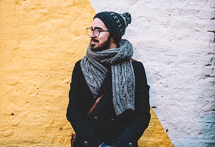 man wearing bobble hat and scarf thumbnail