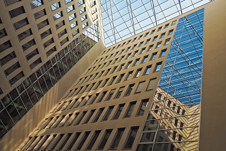 bottom view photography of brown building thumbnail