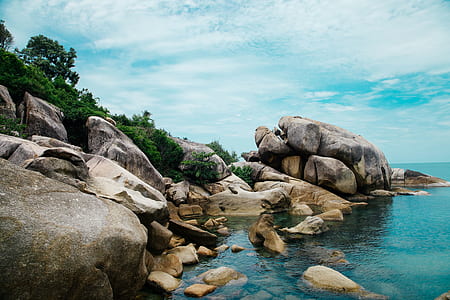 boulder near body of water thumbnail