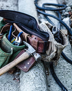 black and silver hammer on brown utility belt thumbnail