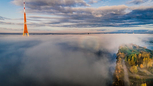 White an D Red Tower on Body of Water thumbnail