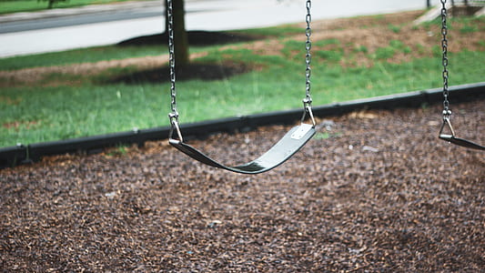 empty green outdoor swing thumbnail