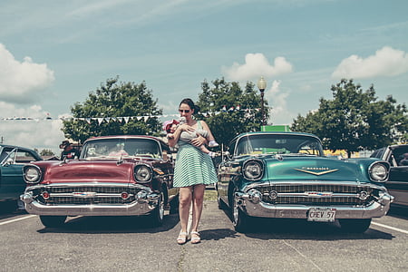 woman standing in between cars thumbnail