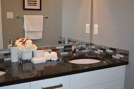 brown and white marble top sink cabinet thumbnail