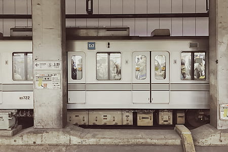 gray train on railway during day time thumbnail