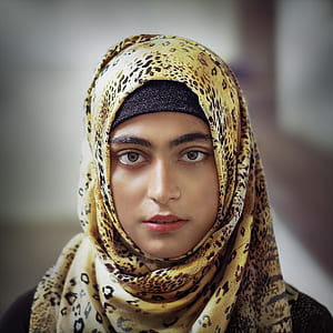 woman wearing yellow and black leopard hijab thumbnail