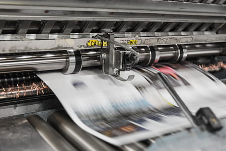 closeup of newspaper printer machine thumbnail