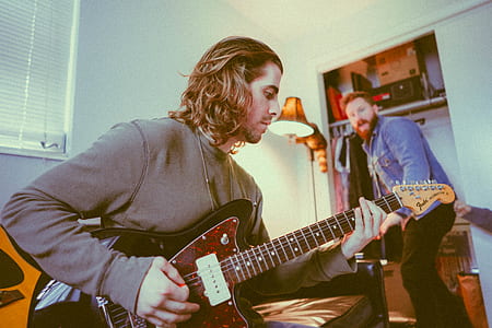 man playing electric guitar thumbnail
