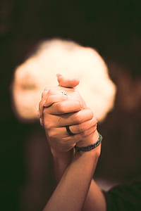 Shallow Focus Photography of Two Persons Holding Hands thumbnail