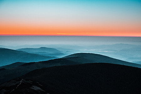 Mountains in the mist at sunset thumbnail