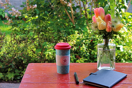 blue and white reusable cup on the table thumbnail