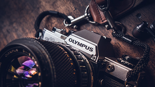 black and gray Olympus SLR camera macro shot thumbnail