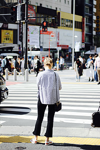 woman standing in front of pedestrian lane thumbnail