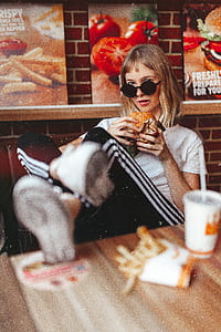 woman sitting on chair putting feet on table thumbnail